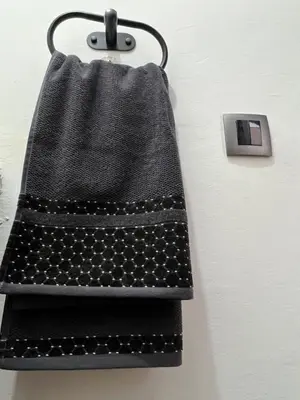 a black lightswitch hanging on a wall at Chalet cosy familial à Imouzzer - calme, nature et confort in Imouzzer Kandar