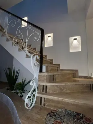 a staircase in a house with two lights on it at Chalet cosy familial à Imouzzer - calme, nature et confort in Imouzzer Kandar
