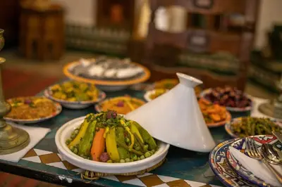a table full of plates of food on a table at Dar Rass Jnane in Fès