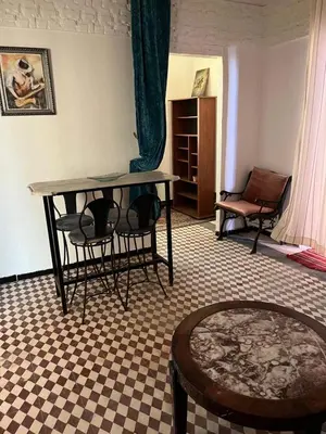 a room with a table and chairs and a table at Rooftop del quinto in Oulad Akkou