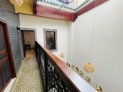 a hallway of a house with a balcony at Dar Bab Boujloud Fez in Fès