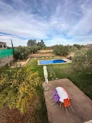 an aerial view of a yard with a swimming pool at Oasis de Calme Villa Piscine Hammam & Vues Atlas in Ouled el guerne