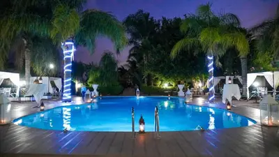 a swimming pool at a resort at night at Villa Eden Marrakech - Luxury Spa Events in Douar bel Rhanodour