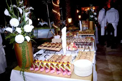 a table filled with different types of food and desserts at Villa Eden Marrakech - Luxury Spa Events in Douar bel Rhanodour
