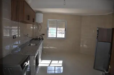 a kitchen with a sink and a counter top at Appartement Laaz in Midelt