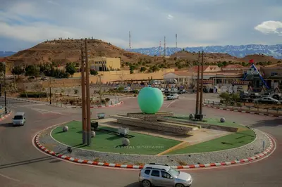 a parking lot with a green balloon in the middle of a city at Appartement Laaz in Midelt