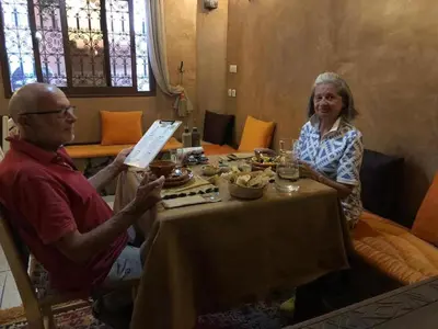 a man and a woman sitting at a table at Dar fatima in Midelt