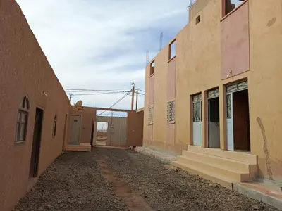 an empty alleyway between two buildings in an old building at Dar Bedda in Merzouga
