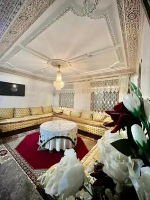 a living room with a couch and a table at Superbe Joli studio indépendant pres de tout in Fès