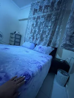 a bedroom with a bed with a purple comforter at Superbe Joli studio indépendant pres de tout in Fès