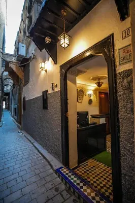 an open doorway to a kitchen in a building at Riad haje skilf in Fès