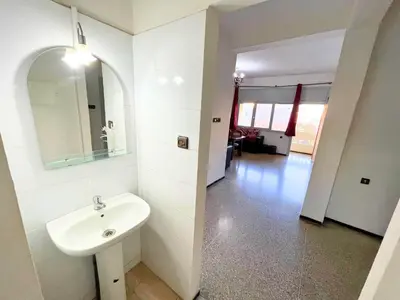 a bathroom with a sink and a mirror on the wall at 3Bed-Room City Centre Apartment - 3 min to Train Station in Fès
