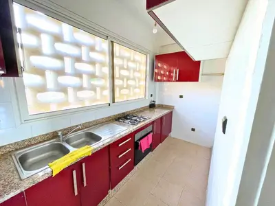 a small kitchen with a sink and a window at 3Bed-Room City Centre Apartment - 3 min to Train Station in Fès