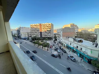 a view of a city street with cars and buildings at 3Bed-Room City Centre Apartment - 3 min to Train Station in Fès