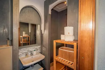a bathroom with a sink and a mirror at Villa Yasmine Sun, Relaxation & Private Pool in Douar bel Rhanodour