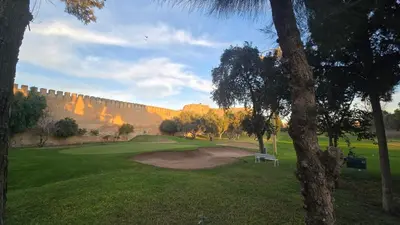 a view of a golf course with a retaining wall at Meknès Cozy House by Yas in Meknès