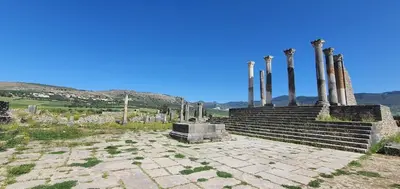 a group of ruins with columns in the background at Meknès Cozy House by Yas in Meknès