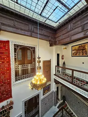a room with a chandelier hanging from the ceiling at Dar Karaouyine Panoramic in Fès