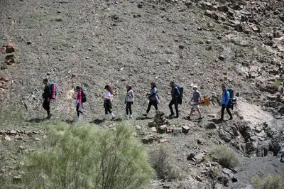 a group of people walking up a hill at Studio la petite Campagne Belgium Camp 50 km Near Marrakesh