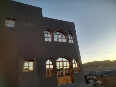 a black building with a group of windows at Studio la petite Campagne Belgium Camp 50 km Near Marrakesh