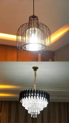 a chandelier hanging from a ceiling with wine bottles at Appartement confortable près du centre Meknes in Meknès