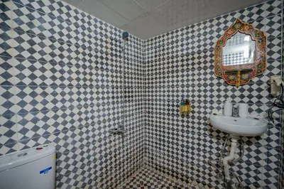 a bathroom with a sink and a mirror at Riad Chams Fes in Fès