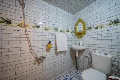 a bathroom with a toilet and a sink at Riad Chams Fes in Fès