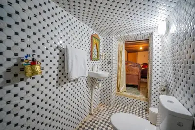 a bathroom with a toilet and a sink at Riad Chams Fes in Fès
