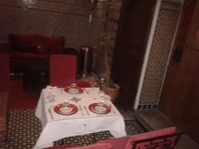 a room with a table with two plates on it at Ryad Naila Fes in Fès