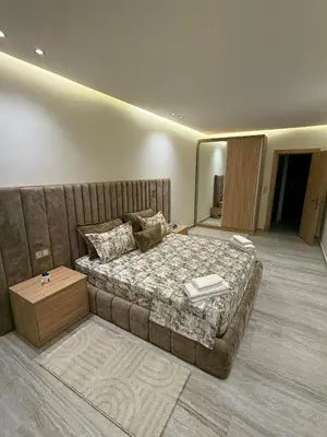 a bedroom with a large bed in a room at villa bijoux in Oulad Akkou