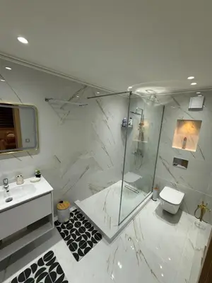 a bathroom with a shower and a sink and a toilet at villa bijoux in Oulad Akkou