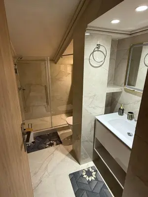 a bathroom with a shower and a sink at villa bijoux in Oulad Akkou
