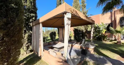 a gazebo in the yard of a house at Maison d'Hotes Oasis Marrakech Route dOuarzazate in Oulad Akkou