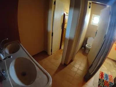 a bathroom with a sink and a toilet at Auberge Merzane in Merzane
