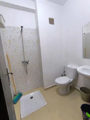 a bathroom with a toilet and a shower and a sink at Les jardins d'Ifrane in Ifrane