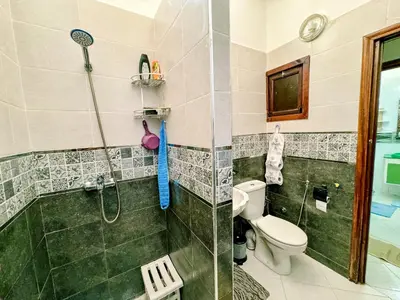 a bathroom with a shower and a toilet at Appartement Prestige Kebibat - Charme marocain in Oulad Akkou