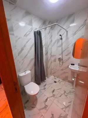 a bathroom with a toilet and a sink at Appartement Calme & Moderne in Meknès