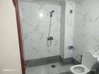 a bathroom with a shower and a toilet at App luxe riad zitoune in Meknès