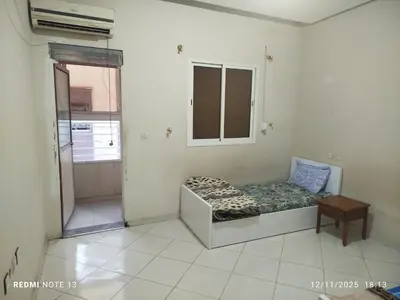 a room with a bed and a window in it at App luxe riad zitoune in Meknès