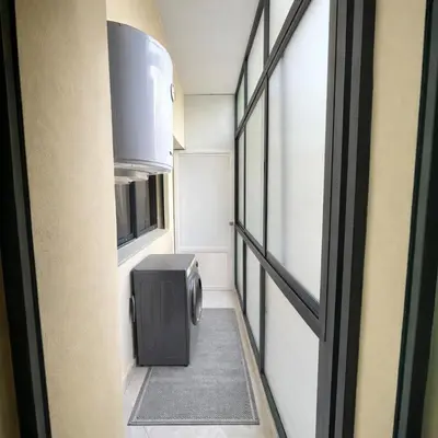 a small hallway with a refrigerator and a window at Prime stay downtown Meknes in Meknès