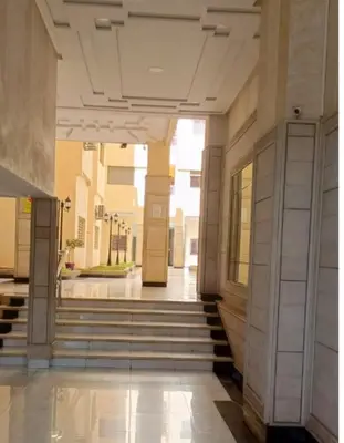 an empty hallway of a building with stairs at Prime stay downtown Meknes in Meknès
