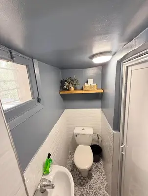 a small bathroom with a toilet and a sink at 2 bedroom apartment in Meknes-Clim, Wifi & Netflix in Meknès
