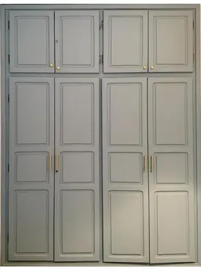 a set of metal garage doors on a wall at 2 bedroom apartment in Meknes-Clim, Wifi & Netflix in Meknès