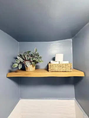 a shelf with a plant and candles on a wall at 2 bedroom apartment in Meknes-Clim, Wifi & Netflix in Meknès
