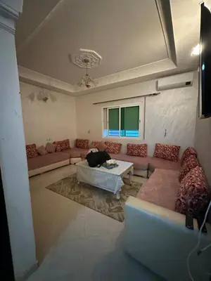 a living room with a couch and a table at OFPPT Otmania in Meknès