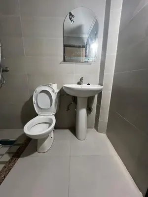 a bathroom with a toilet and a sink at OFPPT Otmania in Meknès