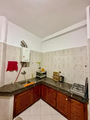 a kitchen with a sink and a counter top at appartement in Fès