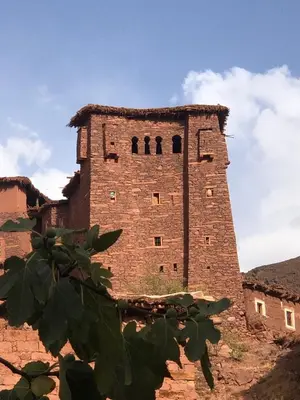 an old brick building with a tower on top at Gite Ifoulou Tassaout in Ifoulou