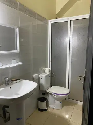 a bathroom with a toilet and a sink at appart près du stade de fes in Fès