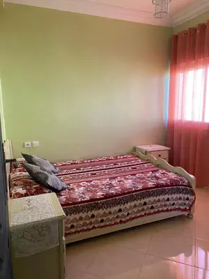 a bedroom with a bed in a room at appart près du stade de fes in Fès